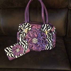 Purple, black, and white zebra print purse